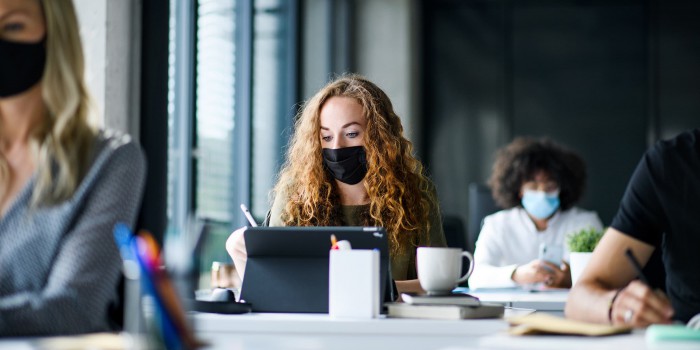 Office workers wearing face masks